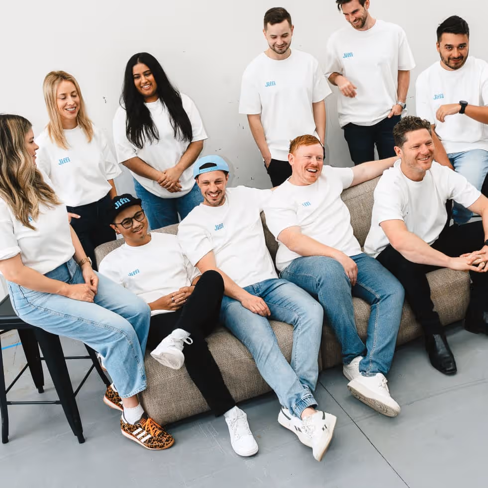 Jiffi team sitting in a couch.